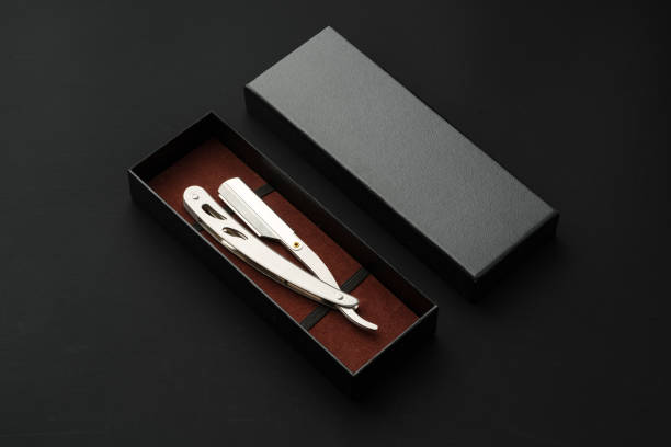 Barber shaving blade on black background close up photo
