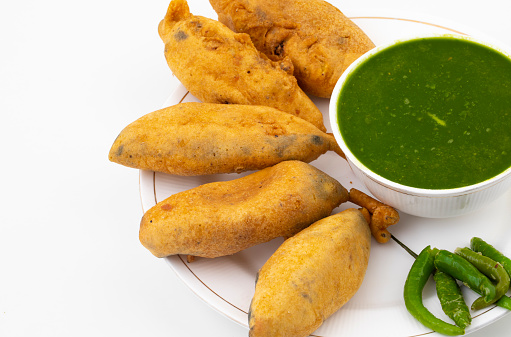 Indian Street Fried Food Spicy Chilli Pakora Served With Sauce & Chutney Also Know as Mirchi Bajji, Mirchi Vada, Mirchi Bada, Chili Cutlet or Chili Bajji It's a Popular Tea Time Snacks From India