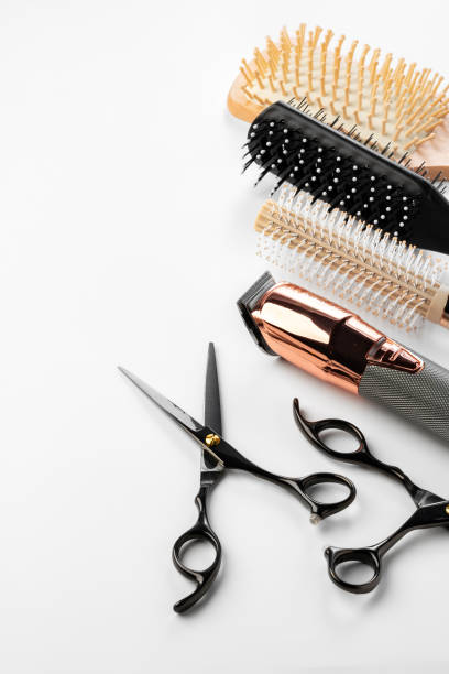 istock Black hairdressing tools and various hairbrushes on white background 2113951698