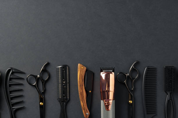 istock An Assortment of Professional Hairdressing Tools Laid Out on a Dark Surface 2113958667