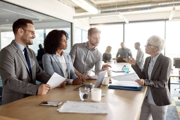 istock Team of entrepreneurs working on a meeting in a modern office. 2114016065