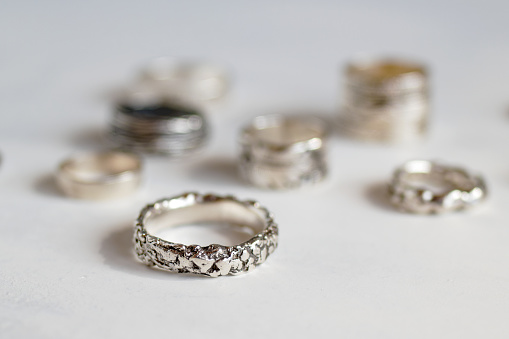 Handcraft elegant silver rings. Elegant jewelry on a soft white background.