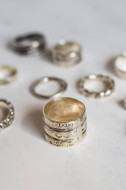istock Silver jewelry on a soft white background. Handcraft elegant silver rings. 2114070574