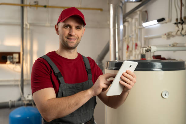 istock Professional Technician Inspecting Industrial Boiler Using a Tablet in a Factory Setting 2114082613