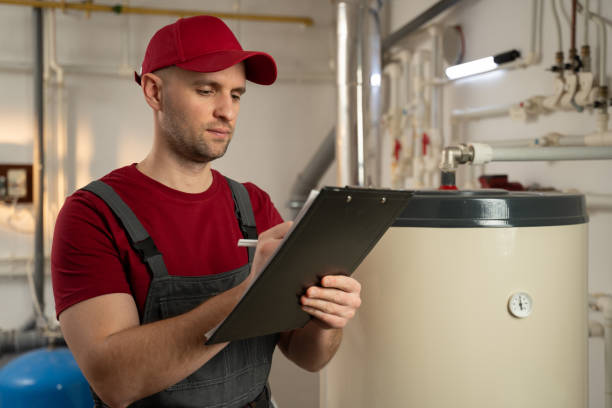 istock Skilled Technician Inspecting Industrial Boiler in Factory Setting During Daytime Shift 2114085827