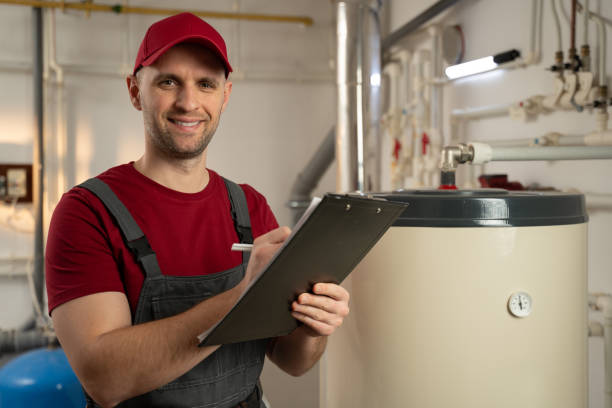istock Skilled Technician Conducting Maintenance Check on Boiler in Industrial Facility 2114087399