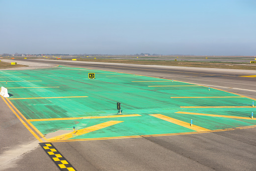 The background of runway marking signs. Arrows and symbols important information to pilots