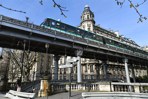 Paris, France-03 21 2024: Elevated Paris metro train passing on the Passy viaduct, France.