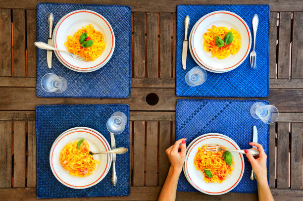 A woman enjoys an evening dinner.