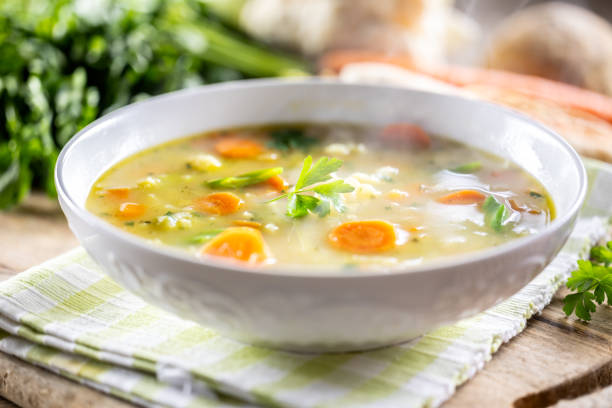 istock Spring vegetable soup with chopped and grated root vegetables, seasoned with yeast. Healthy vegetable vegetarian food. 2114146840