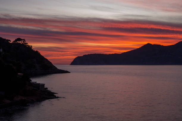 istock Cala Porroig bay red sunset 2114149938