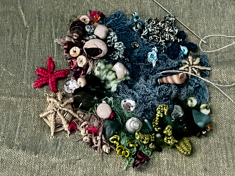 Work in progress. Coral reef embroidery on silk. Textured stitches, beads and sea shells. Embroidered by myself