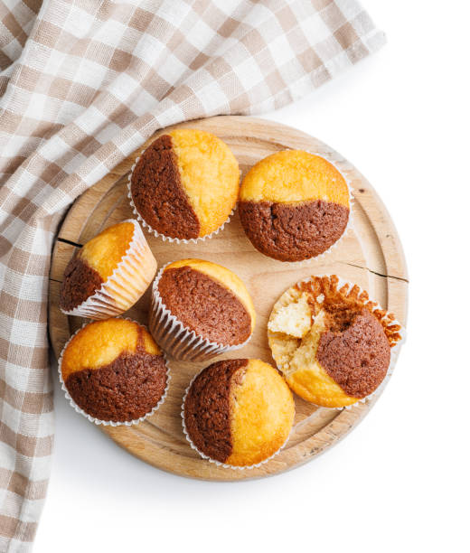 istock Close Up of a Muffins on cutting board isolated on white background. 2114158746