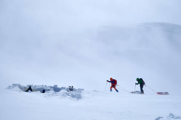 istock Mountain climbers with backpack and pulka on the glacier during their attempt to climb Denali in Alaska. 2114196345
