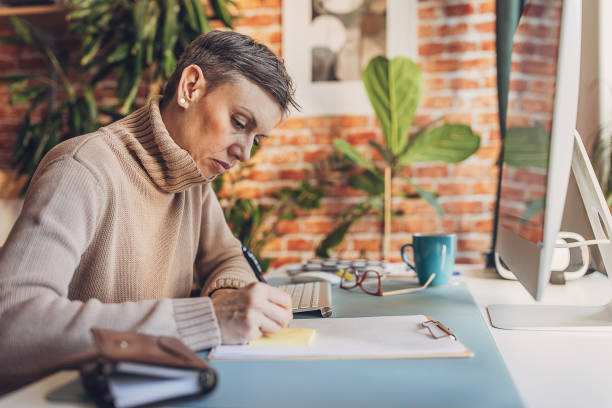 istock Woman working in home office 2114207016