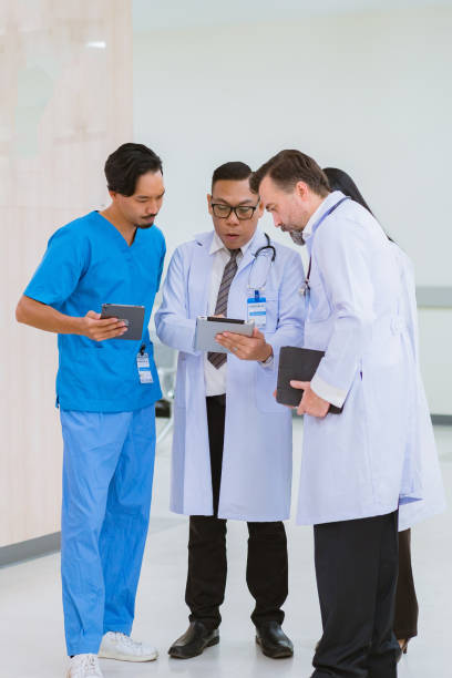 istock Medical, meeting and tablet for team in office in discussion, brainstorming and planning for data analytics 2114208607