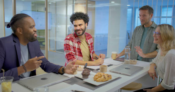 istock Business people talking each other in office canteen 2114215059