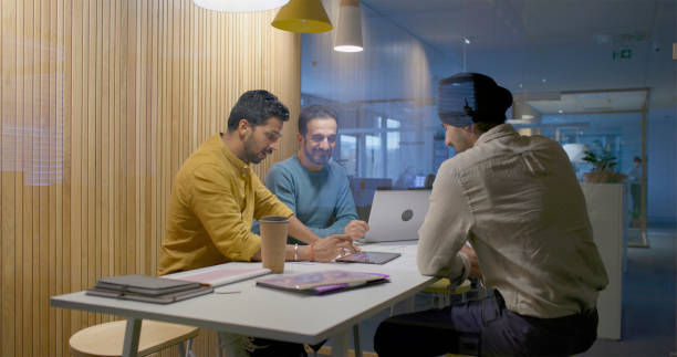 istock Businessmen having meeting in office 2114215060