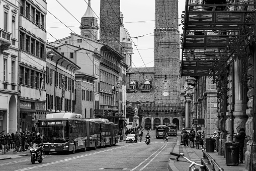 Bologna, Emilia, Romagna, Italy - February 27, 2020: The two towers, Garisenda and degli Asinelli seen from Via Rizzoli.\nThe two towers are commonly recognized as the symbol of Bologna and stand in the heart of the city at the entry point of the ancient Via Emilia
