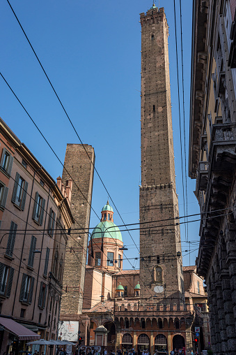 Bologna, Emilia, Romagna, Italy - October 27, 2022 The two towers, Garisenda and degli Asinelli seen from Via Rizzoli.
The two towers are commonly recognized as the symbol of Bologna and stand in the heart of the city at the entry point of the ancient Via Emilia