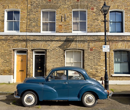 Morris minor parked in a street