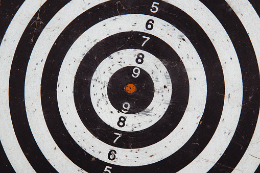 vintage tone image of empty dart board after hard training.