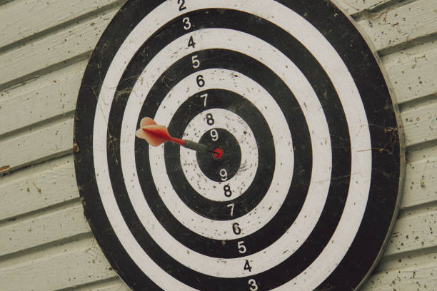 istock One Red Dart Arrow Hitting Target on the Center 2114285044