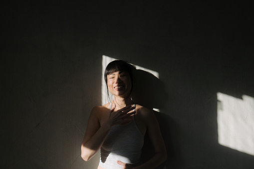 Photo of a Japanese woman in sunlight.