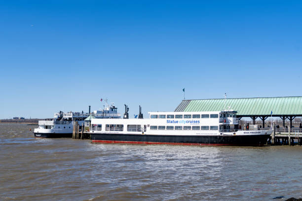 Liberty island, New York, USA - March, 2024. Statue City Cruises, Liberty ferry at Liberty Island on the Hudson River.