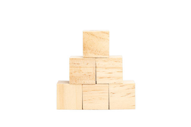 istock Wooden blocks stacked in a pyramid on white background 2114322633