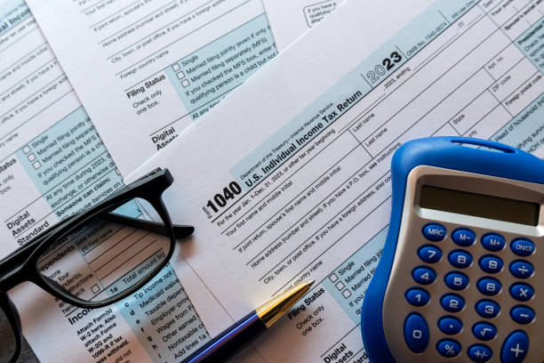 istock Tax time concept blank form with calculator. 2114336866