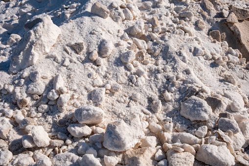 Piles of salt in the salt flats of Iptuci in Prado del Rey, Cadiz province, Andalusia, Spain. Settling ponds for salt production by evaporation.