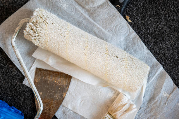 istock Paint roller and brush on paper tissue during home renovation 2114360842