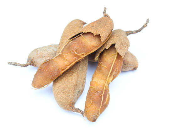 istock Tamarind fruits on white background 2114365031