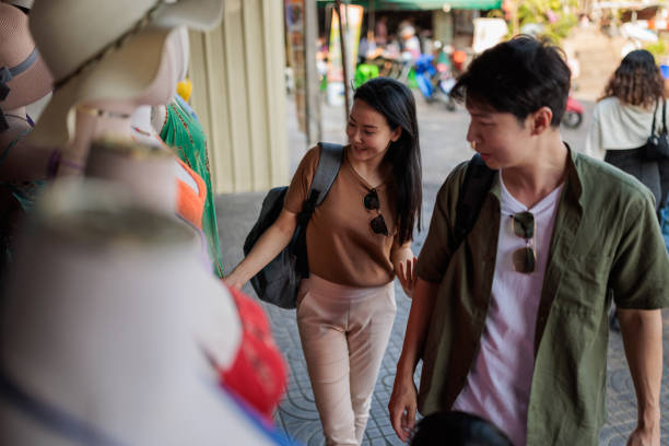 istock Family browsing a local market together 2114371353