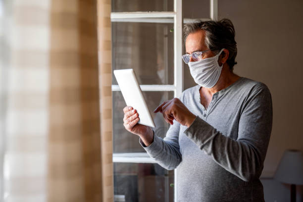 istock Senior man consulting with her doctor online 2114404389