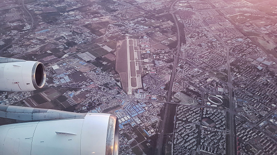 Beijing, China - april 25, 2017 - the view of Liangxiang Air Base in beijing city during flight by airbus a340 window of plane