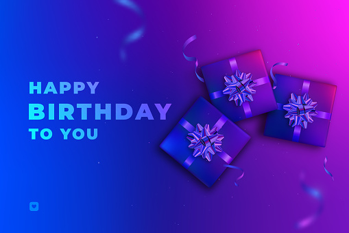 Gifts with blue and pink neon hues and Happy Birthday to you text on neon colorful surface.