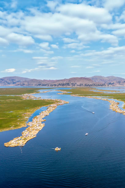 Uros Islands, Lake Titicaca, Peru: The floating islands of Uros are located in Lake Titicaca, the world's highest navigable lake, close to Puno at 3.812 metres above sea level. These floating islands are made out of reed which is an aquatic plant that grows on the surface of the Lake Titicaca.
