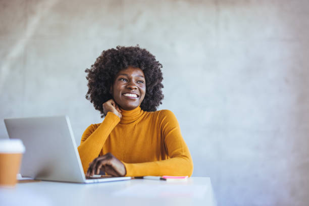 istock Positive woman video calling using laptop. 2114429740