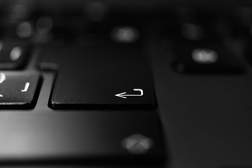 Computer keyboard on dark background