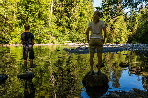 two people standing at a lake in Canada