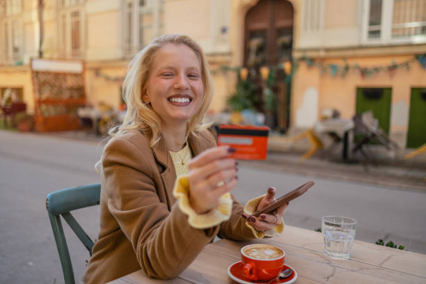 istock Young woman buying online 2114436963