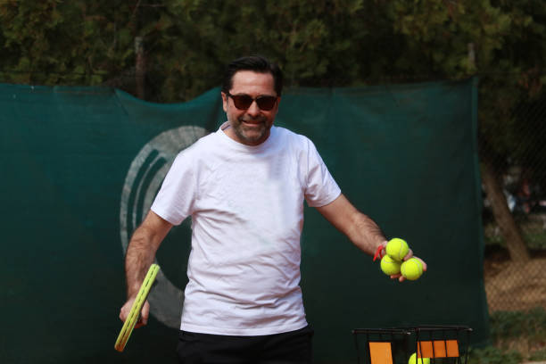 istock Mature tennis coach on training 2114443895