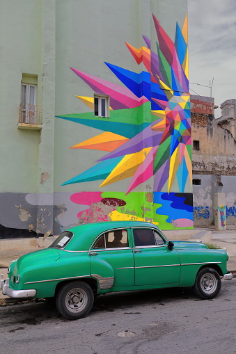 Havana, Cuba-October 8, 2019: Green American classic car -almendron, yank tank- Chevrolet Styleline DeLuxe 4-door Sedan 1952 parked on Campanario Street between Malecon Promenade and San Lazaro Street