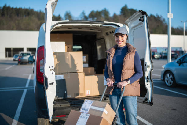 istock Pushing a trolley cart with parcels stacked on it. 2114456102
