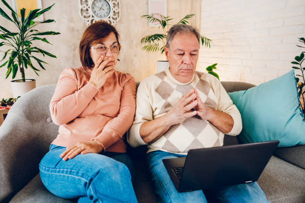 istock Couple looking at the bills at home 2114462930