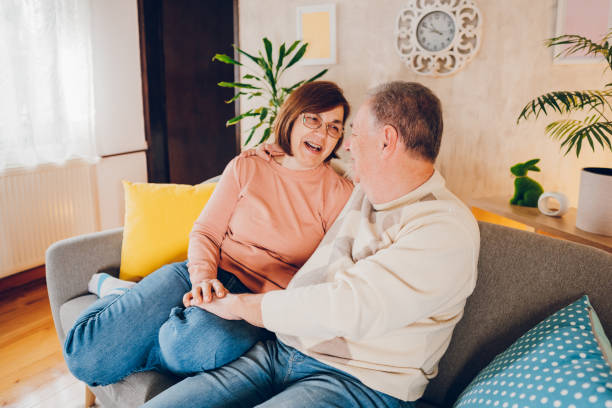 istock Happy couple enjoying at home 2114475451
