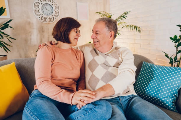 istock Happy couple enjoying at home 2114476478