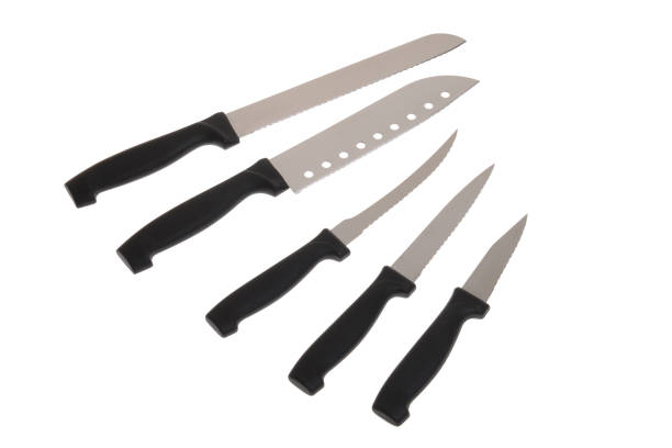 Full kitchen knife set on white background stock photo